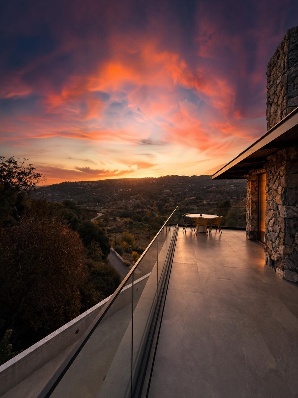 Terrace dining table with valley and sunset views